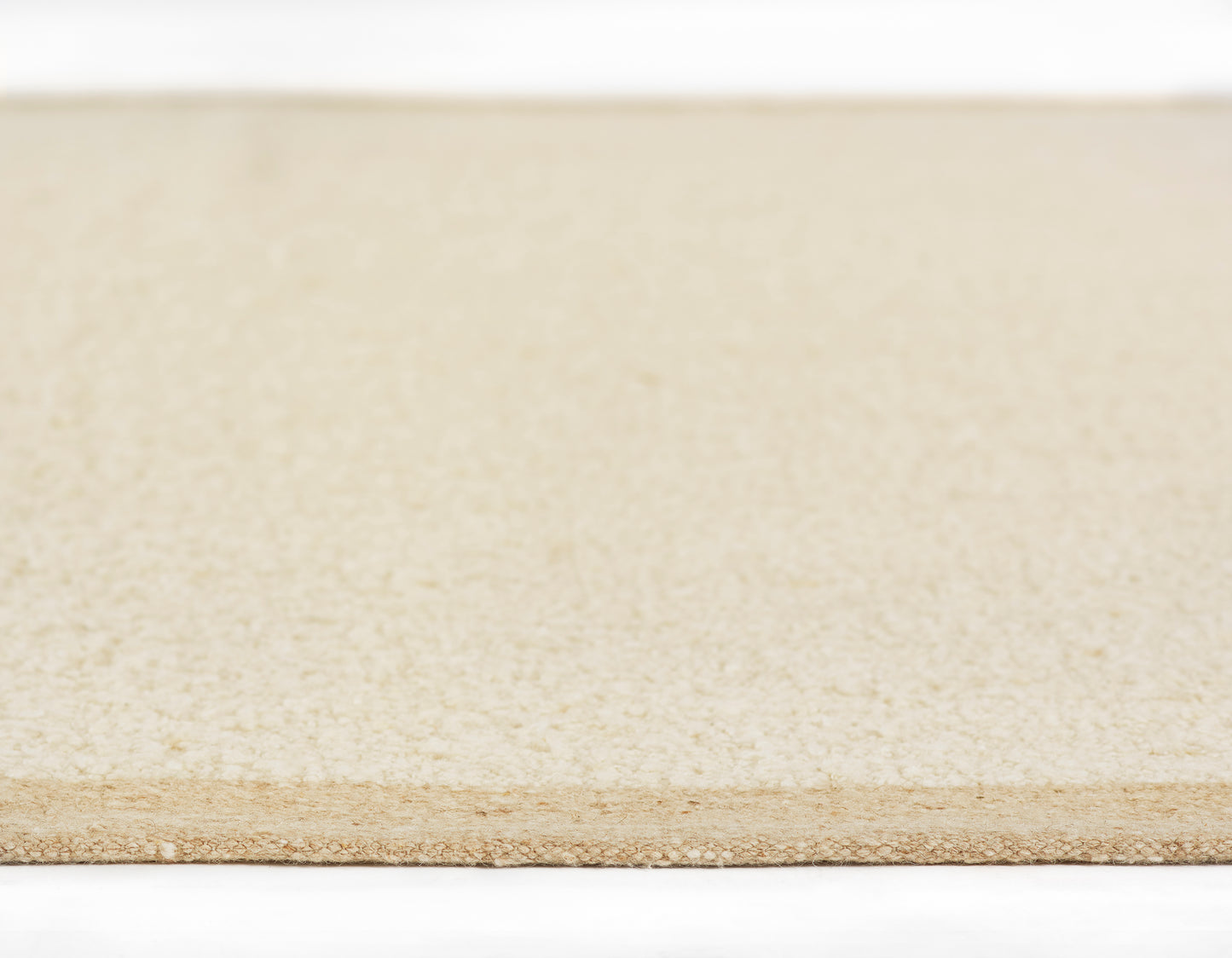 Beige rug with subtle woven texture; rectangular 10' x 14' area rug.