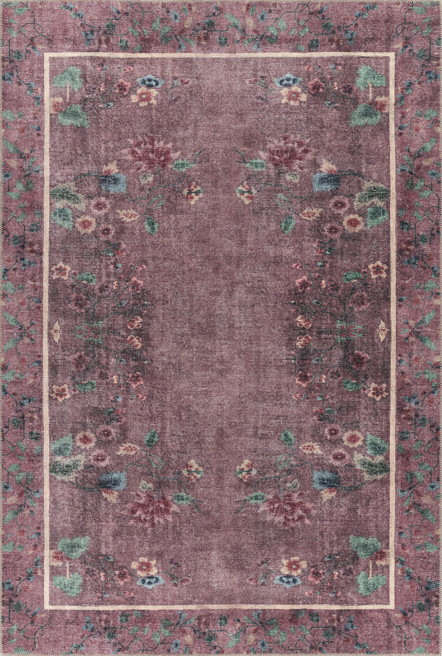 Purple floral area rug with a pale pink border and vine border, vintage distressed look; rectangular decorative rug.