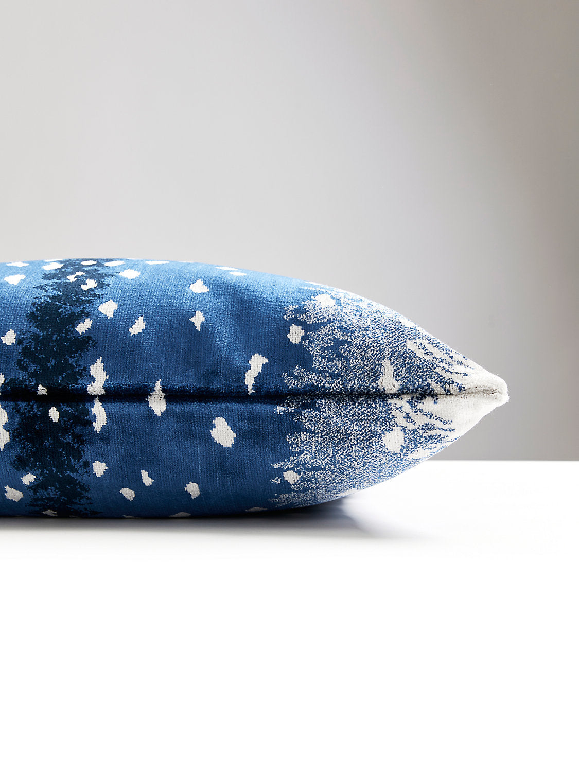 22-inch Scalamandré Antelope Midnight designer throw pillow with ombré animal print pattern in rich midnight blue tones. Luxury decorative accent pillow handcrafted in the USA with textured fabric and feather down insert for upscale living rooms, modern glam interiors, designer sofas, and luxury home decor.