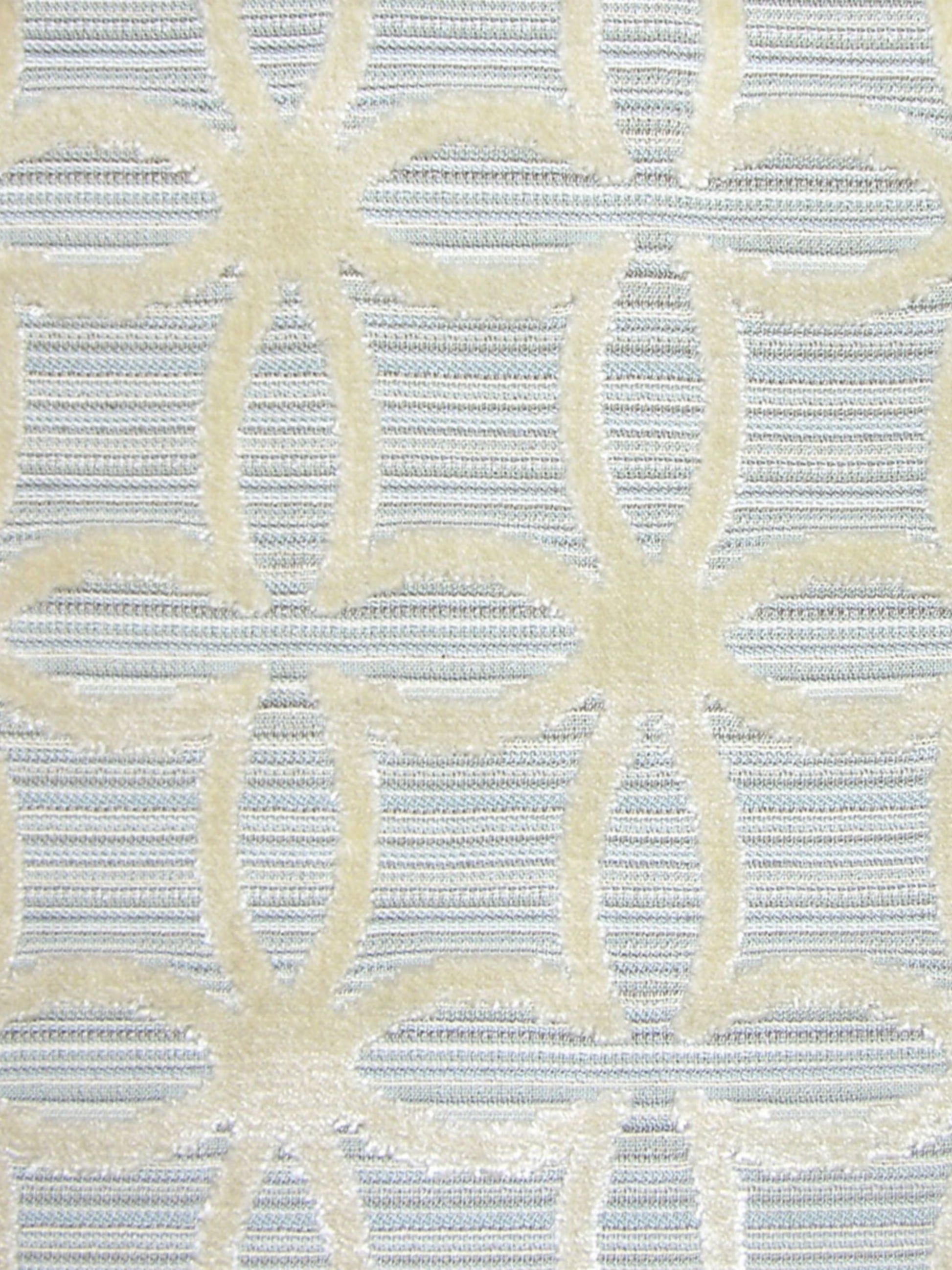 Light blue woven fabric with pale yellow interlocking circular lattice pattern; damask-style upholstery or drapery textile.