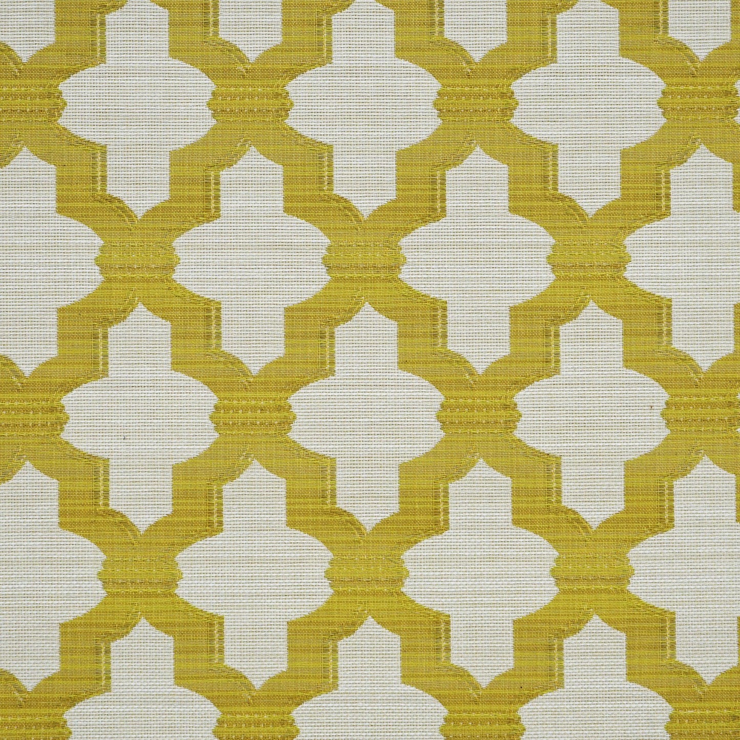 Mustard yellow quatrefoil lattice on beige woven fabric; geometric upholstery or drapery textile.