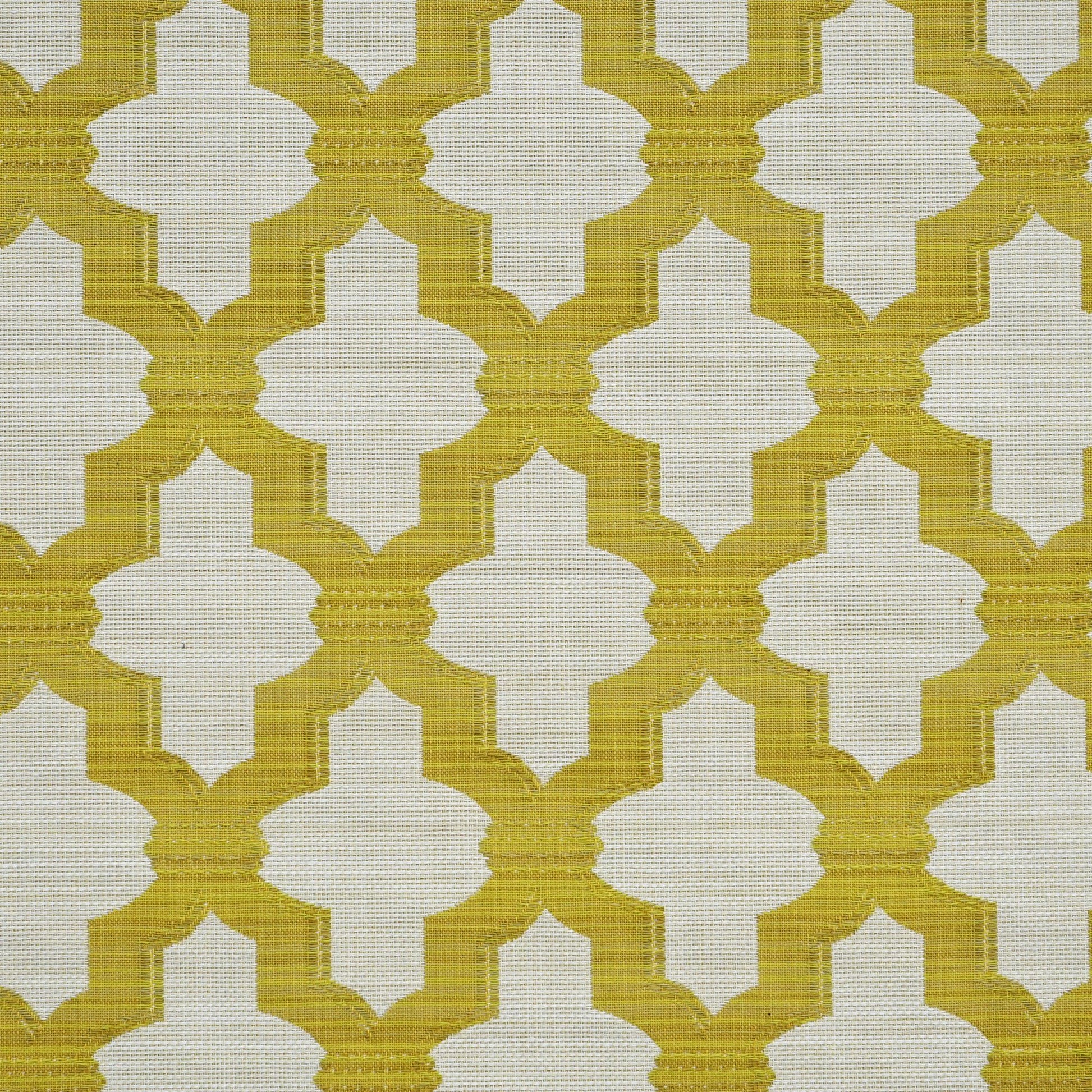 Mustard yellow quatrefoil lattice on beige woven fabric; geometric upholstery or drapery textile.