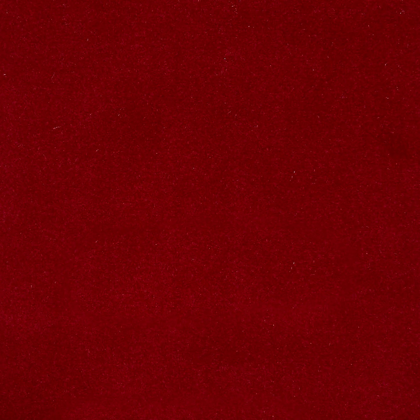Pink velvet fabric close-up with a soft plush nap; versatile material for upholstery and apparel.