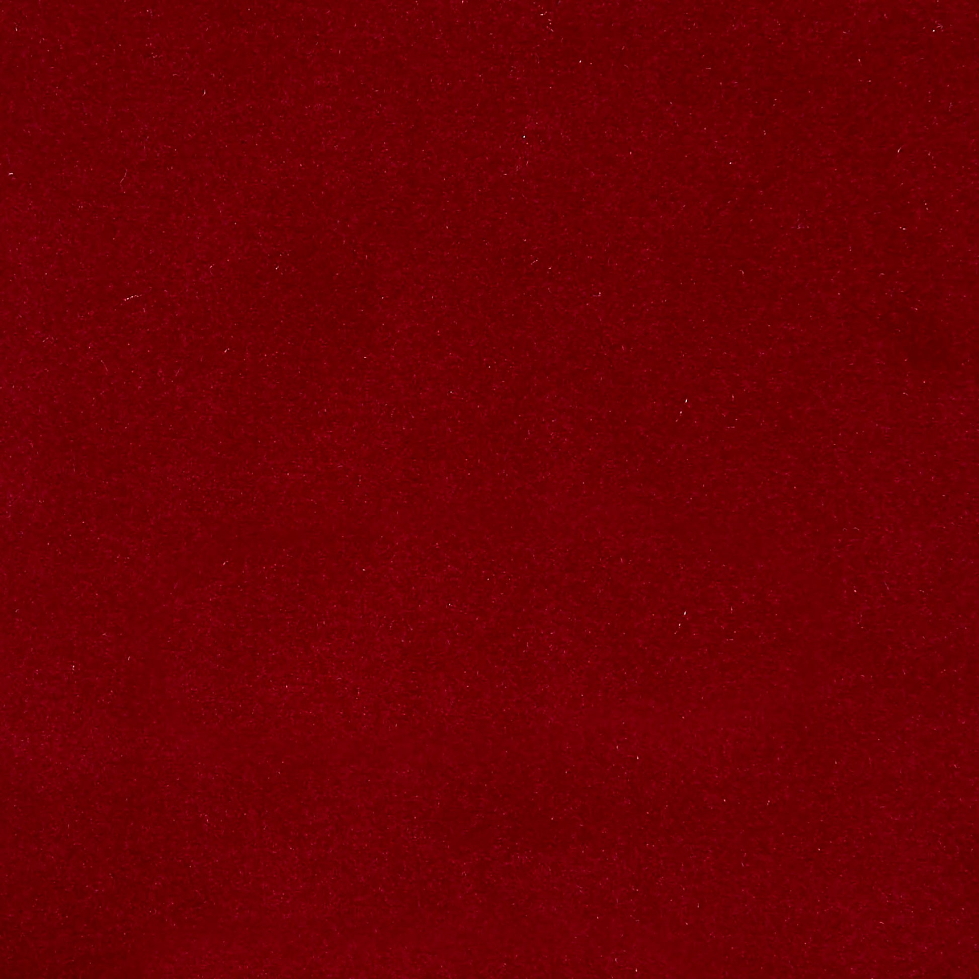 Pink velvet fabric close-up with a soft plush nap; versatile material for upholstery and apparel.