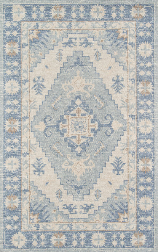 Blue and ivory Anatolian-style rug with a large central diamond medallion, stepped geometric borders, and pale floral border.