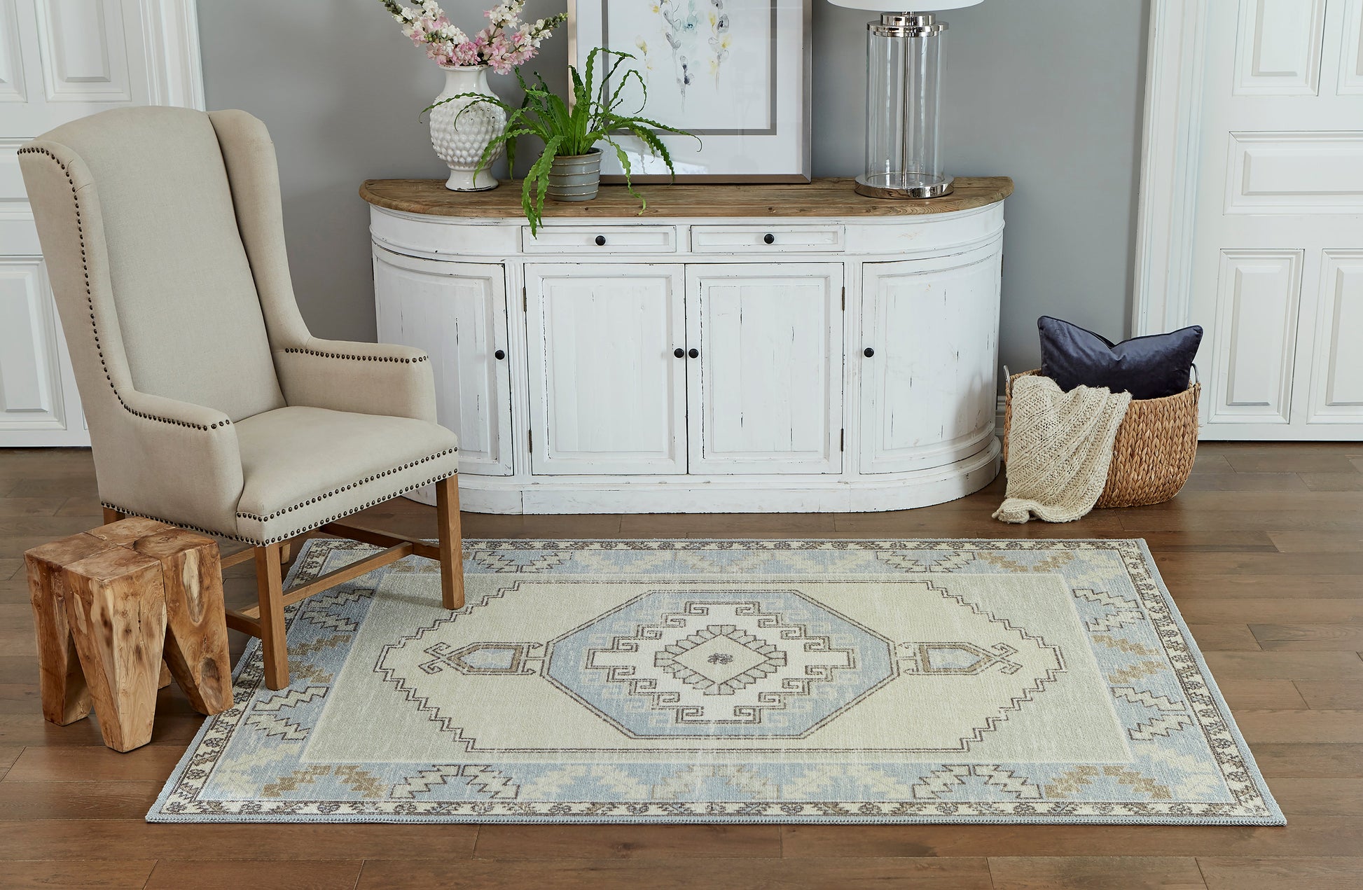 Pale blue geometric rug.