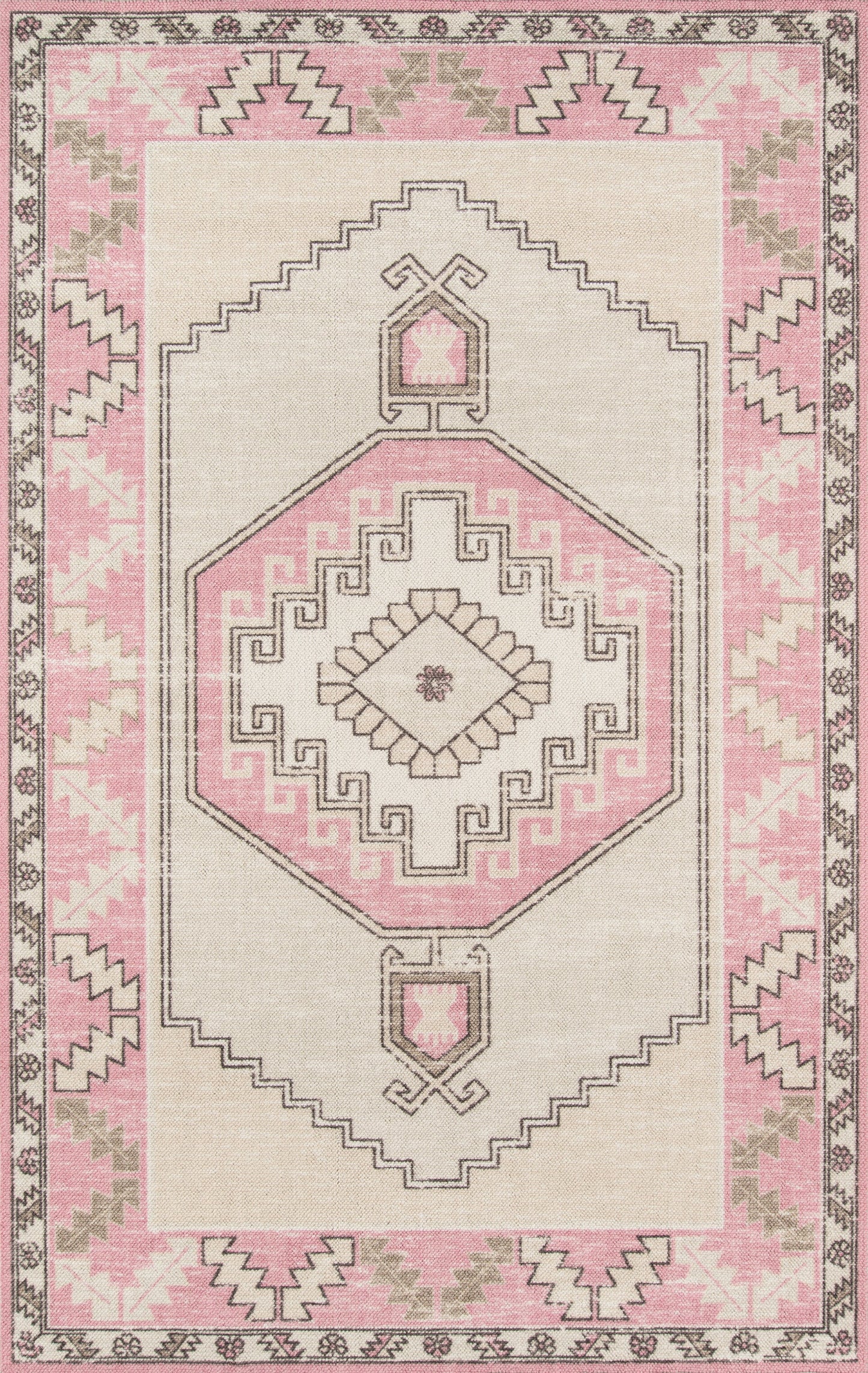 Pink and beige boho-style area rug with central geometric medallion and stepped borders.