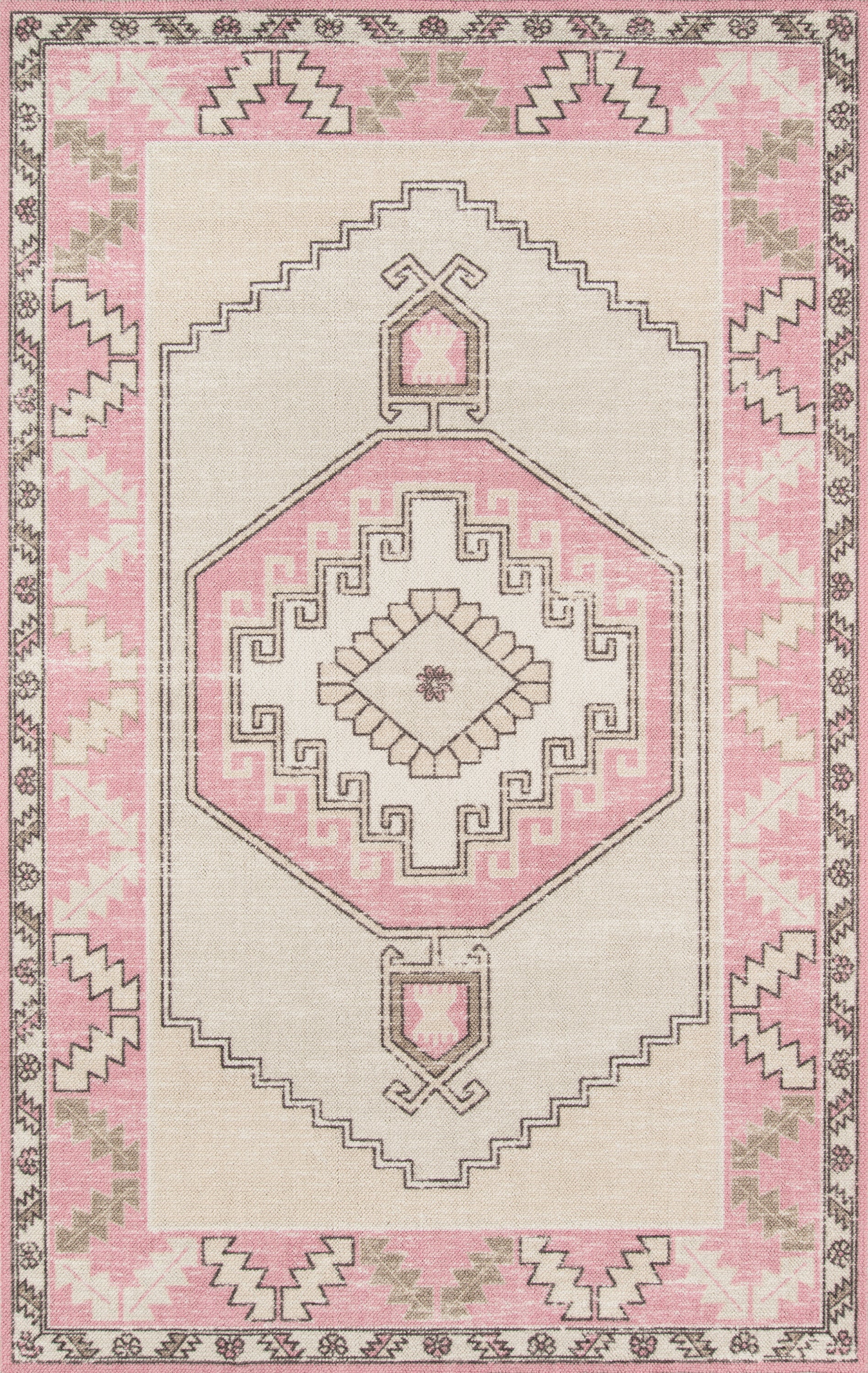Pink and beige boho-style area rug with central geometric medallion and stepped borders.