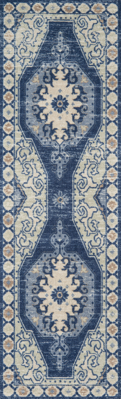 Anatolian-style blue and ivory area rug (7' x 9') with dark navy central medallions and pale floral border.