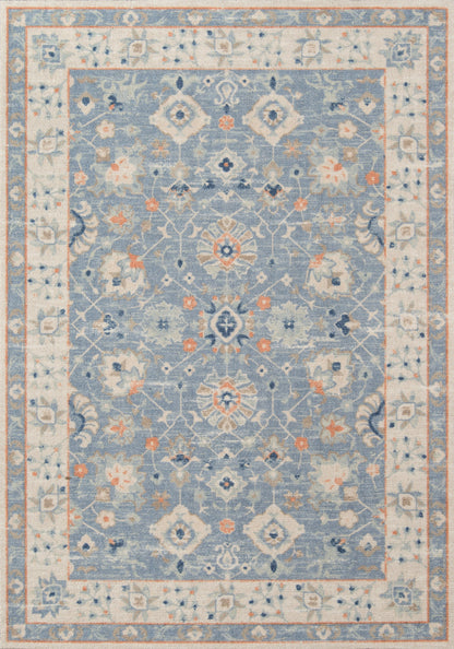 Rectangular oriental-style area rug in blue and ivory with floral medallion motif and decorative border, orange accents.