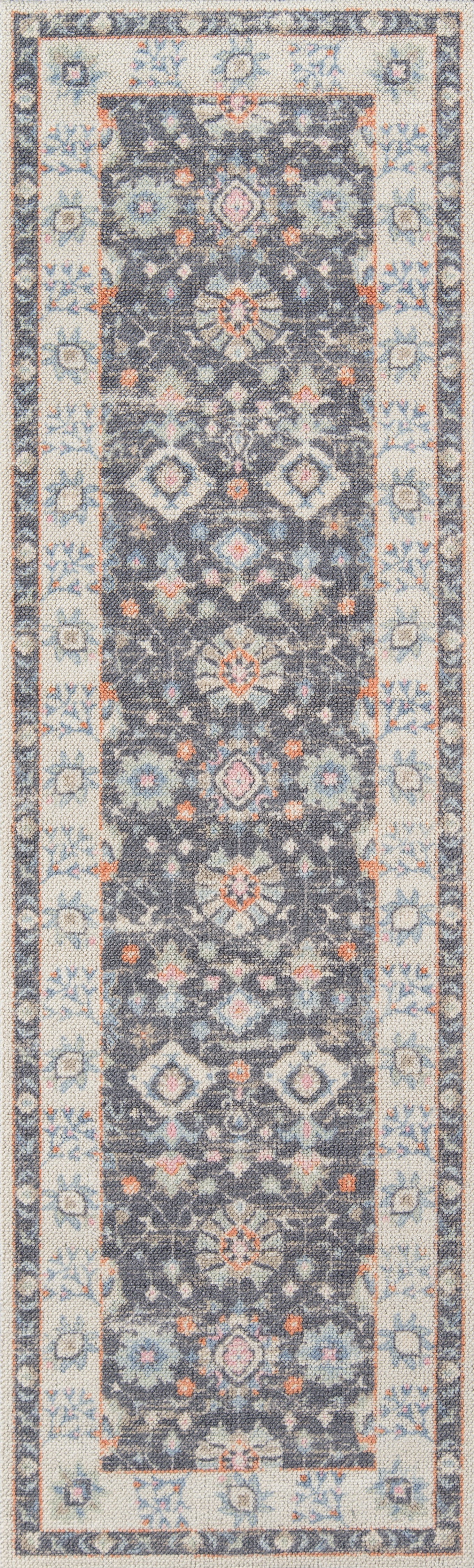 Anatolian-style long runner with navy field, repeating floral medallions, and cream border in blue and rust hues.