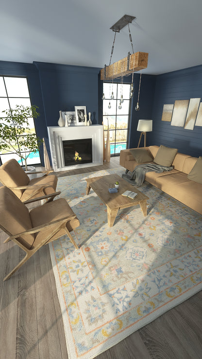 Cozy living room with navy walls, beige sofa and chairs, light wood coffee table, fireplace, chandelier, pastel rug, windows.