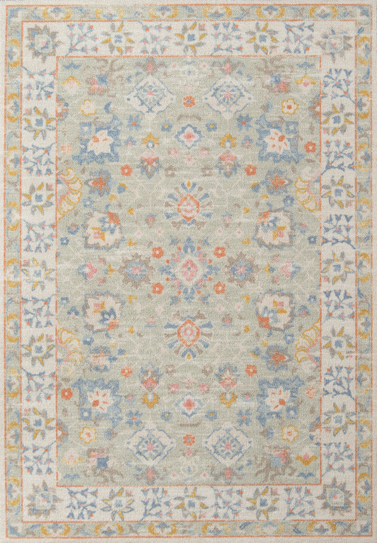 Pastel blue-gray oriental rug with central medallion, soft floral motifs, and pale pink-yellow-blue border.