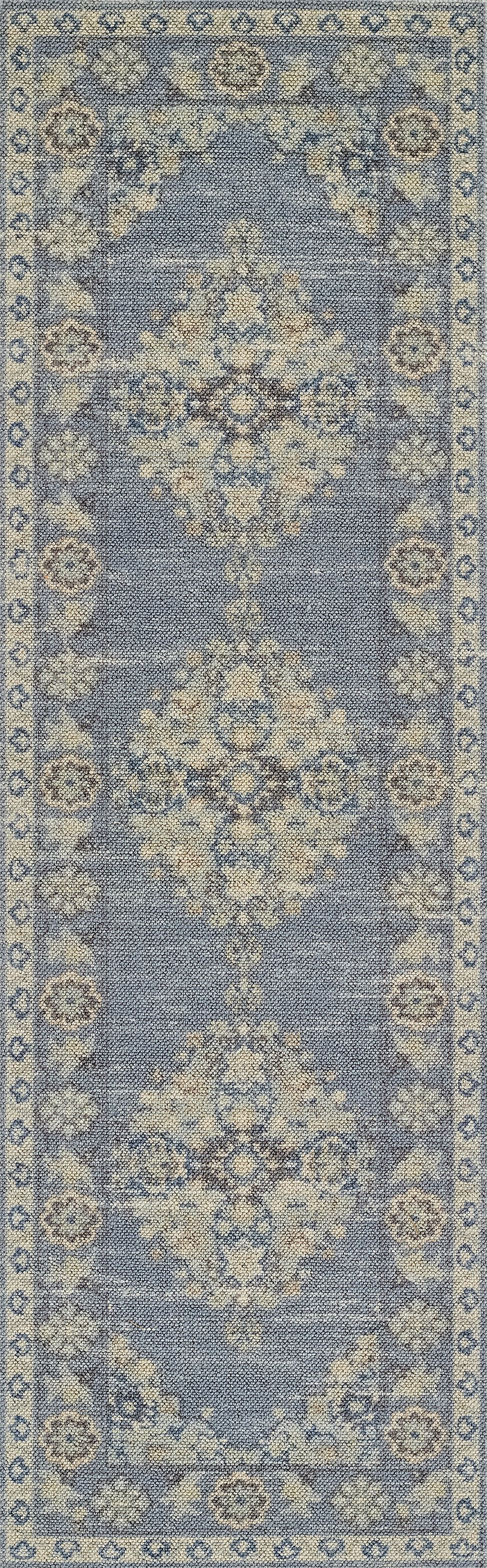 Blue oriental runner rug with ivory floral medallions and decorative border.