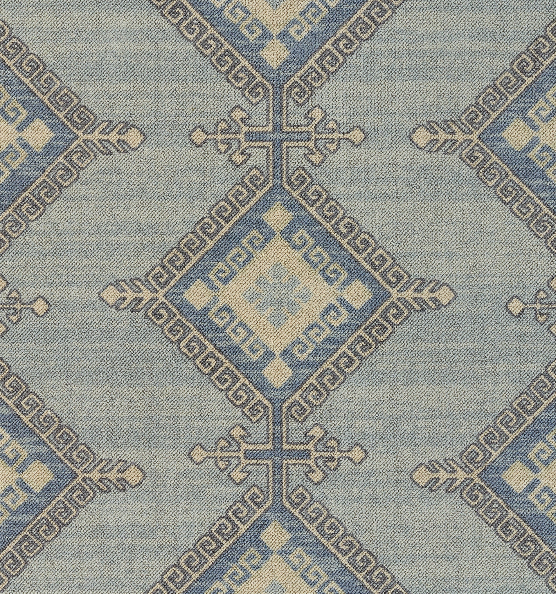 Blue and ivory geometric Anatolian textile with diamond motifs and Greek key borders; woven fabric for rugs or throws.