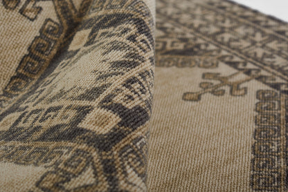 Beige and dark brown woven kilim-style runner rug with geometric borders and medallion motifs, rectangular.