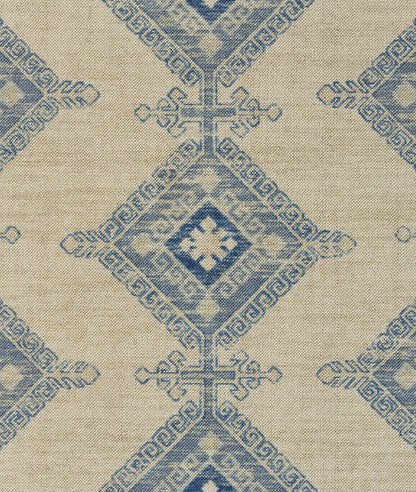 Beige rug with a repeating blue diamond medallion pattern; vintage-inspired design.