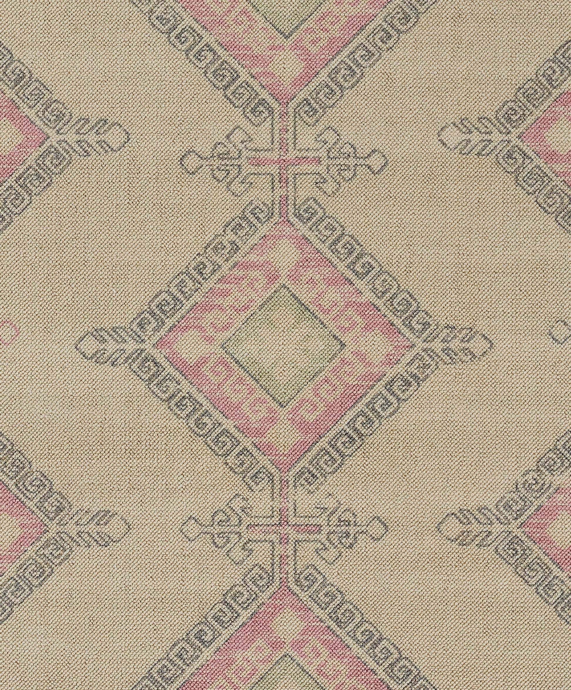 Beige woven fabric with pink diamond motifs and Greek key borders in a repeating geometric jacquard pattern.