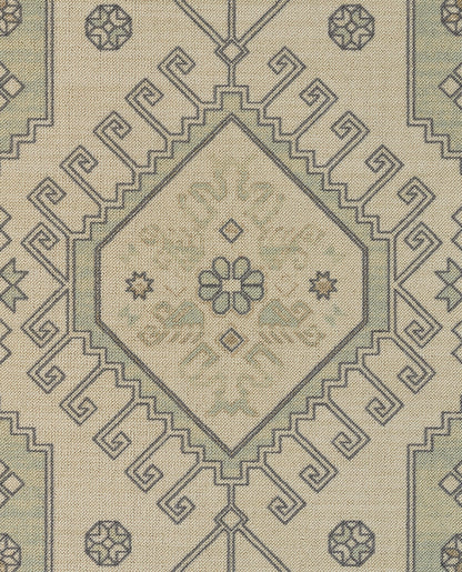 Cream woven rug with blue geometric diamond medallion and Greek key border, oriental-inspired decor