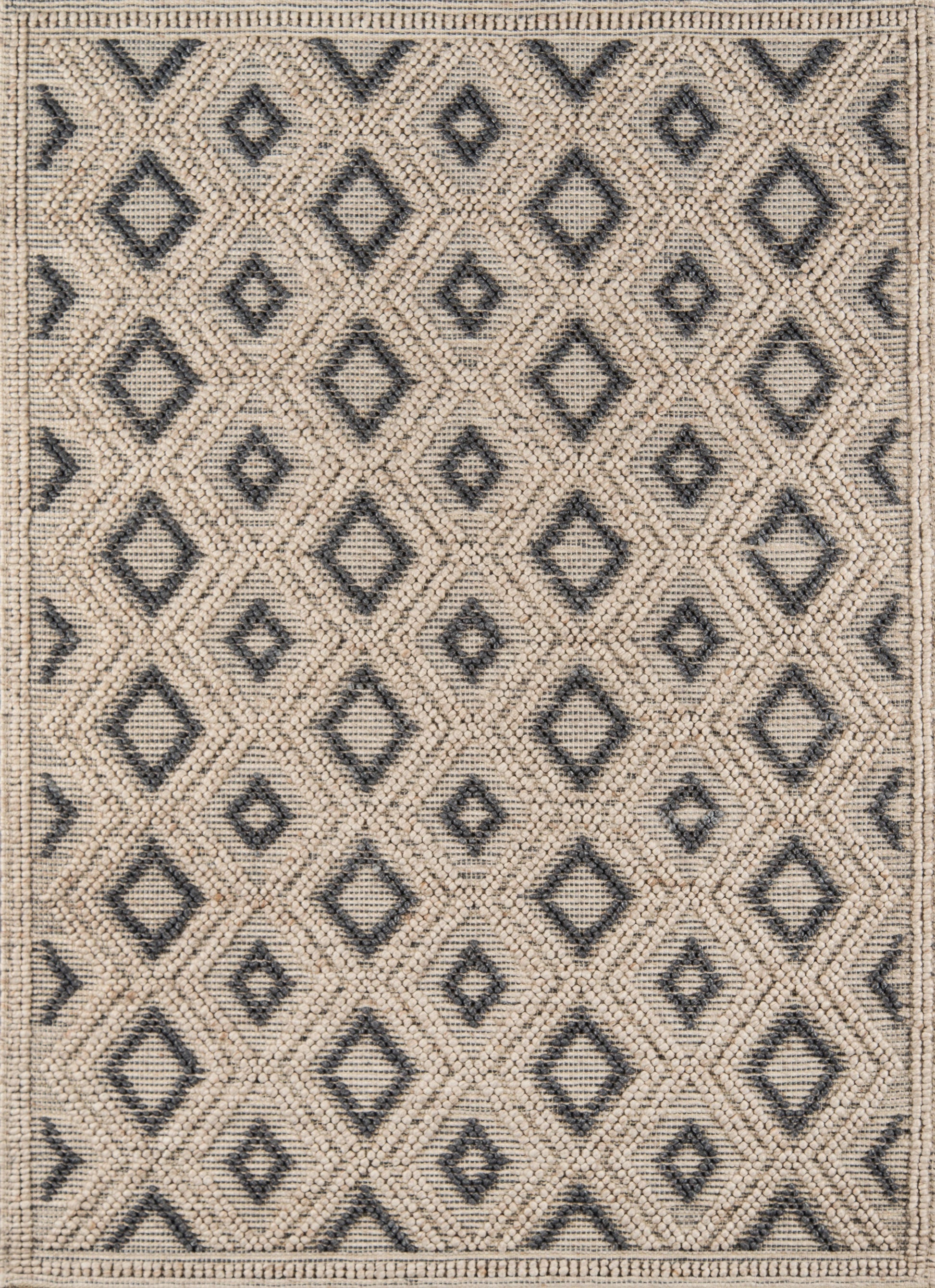Beige woven area rug with charcoal diamond lattice pattern, textured border and geometric neutral style.