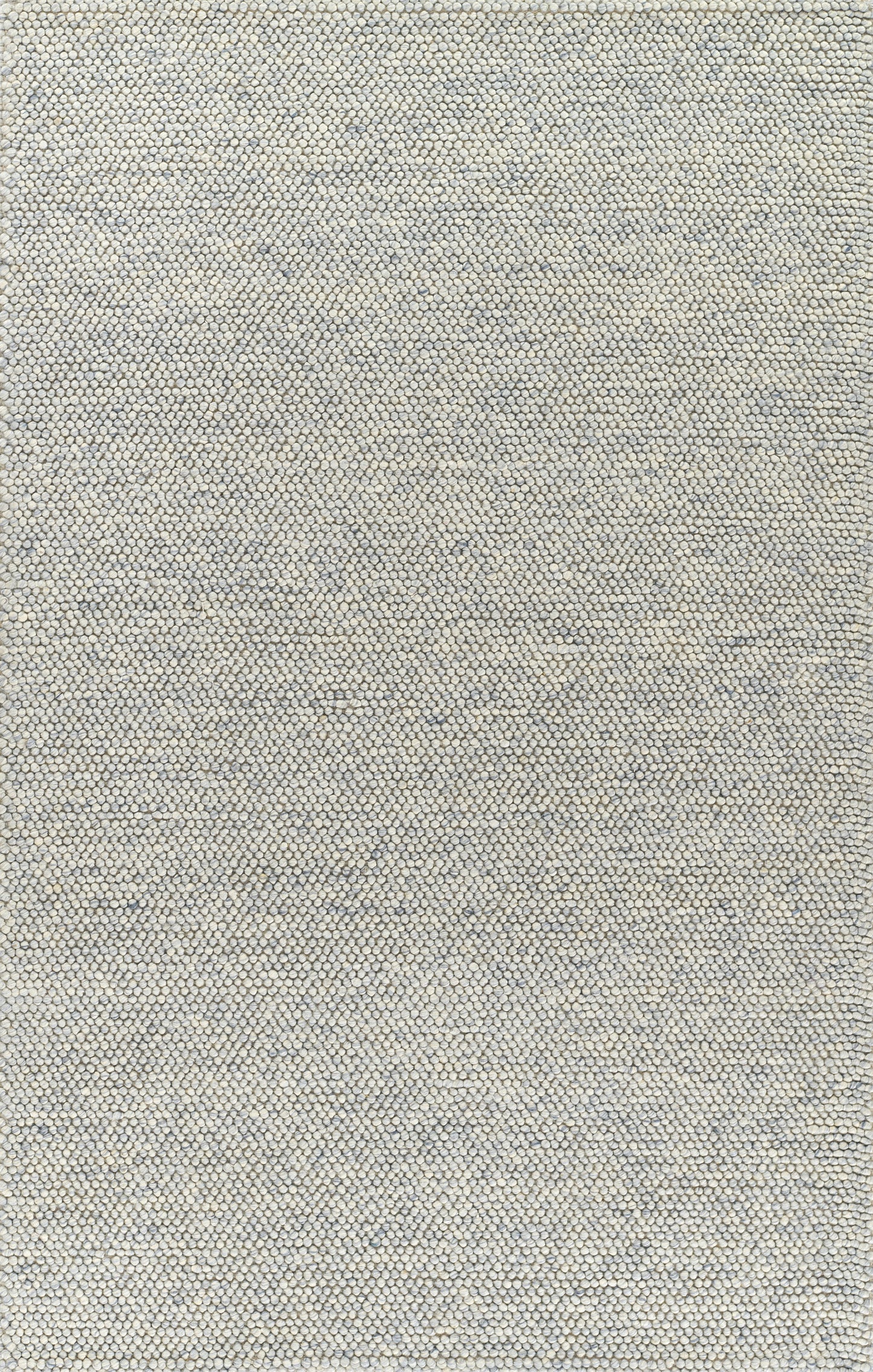 Beige rug with a tiny grey-blue pebble pattern; close-up texture.