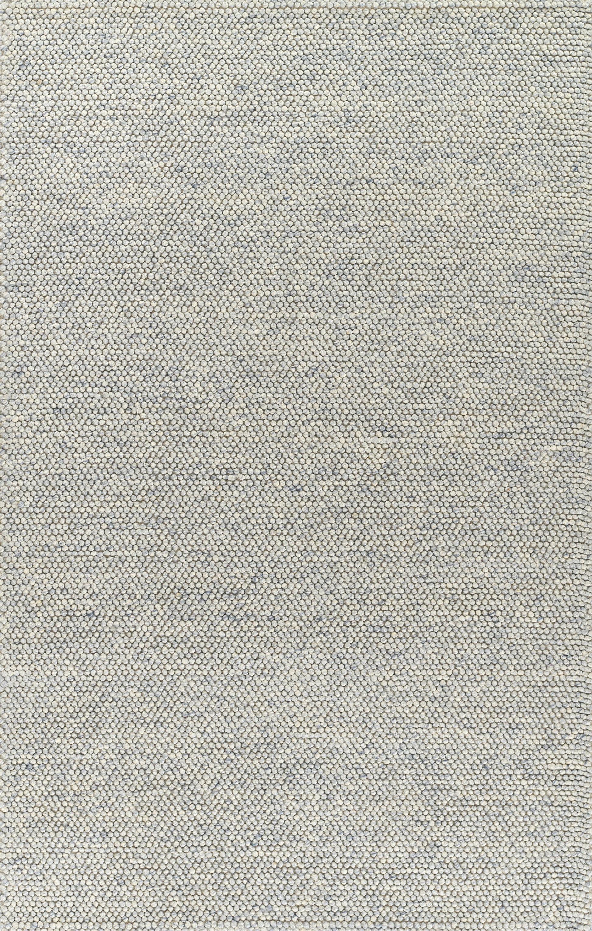 Beige and blue pebble-textured rug with tiny circular tuft pattern; neutral, modern coastal decor.