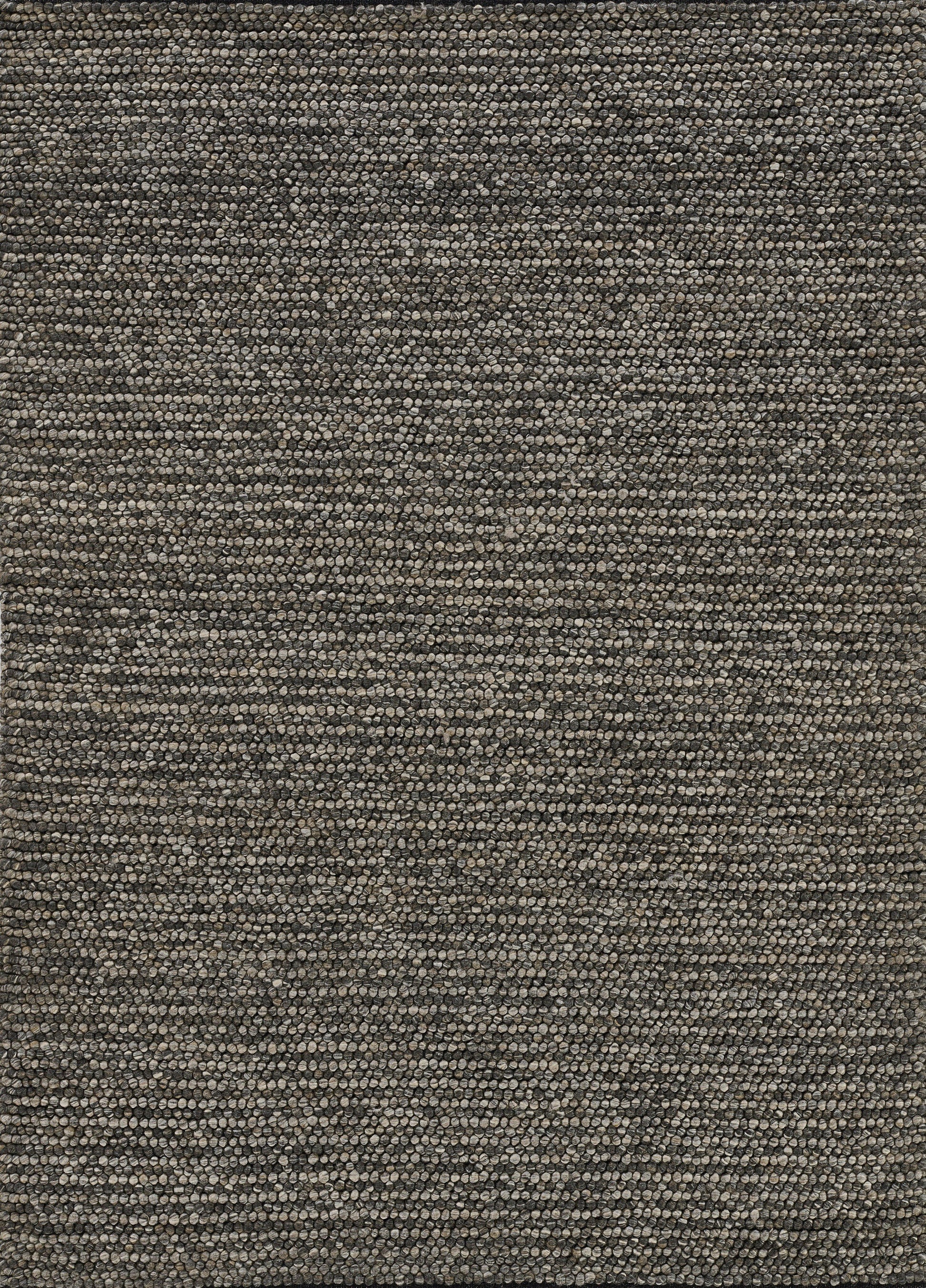Close-up of pebble-textured rug in brown, gray and taupe tones; dense looped fibers create a neutral, earthy pattern.