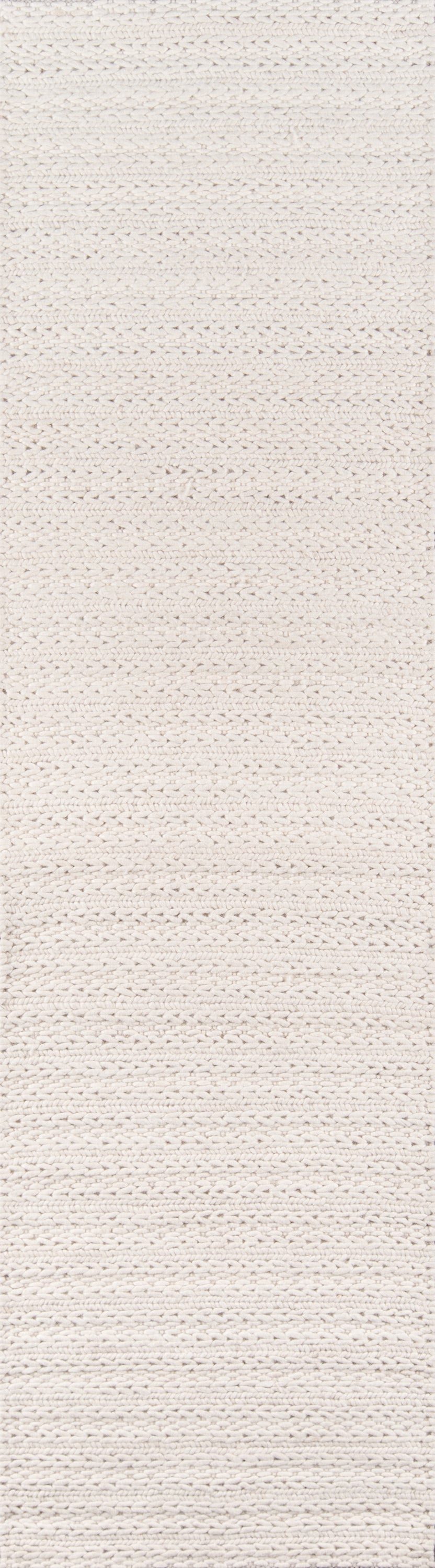 Ivory chunky knitted rug with horizontal ribbed weave and soft textured surface.