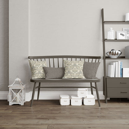 Dark metal-framed bench with a wooden slatted seat and floral and grey fabric upholstery on cushions in a modern neutral living room