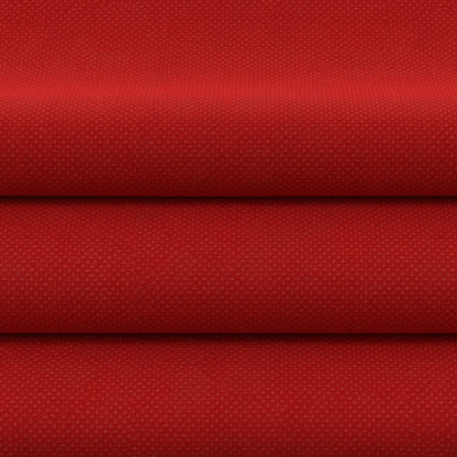 Red solid fabric, folded into stacked horizontal layers.