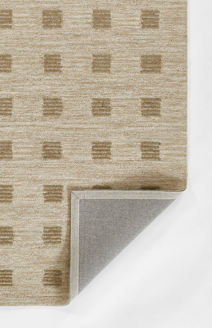 Beige textured woven rug with tan square grid pattern; folded corner shows gray backing.