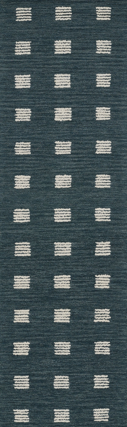 Blue woven rug with white rectangular tufted dots in a neat grid pattern.