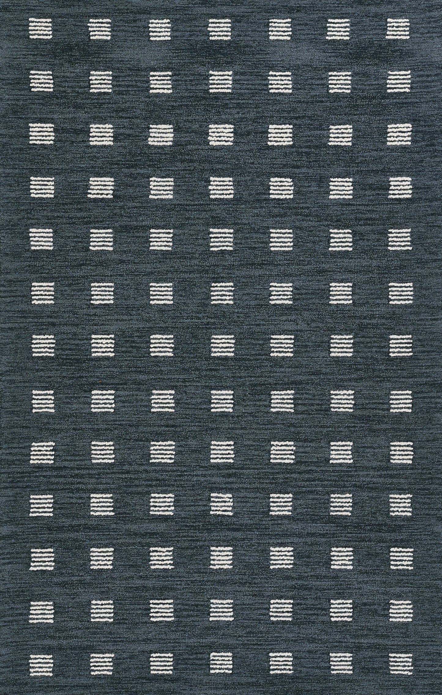 Blue textured rug with repeating white stitched-square blocks forming a geometric grid.