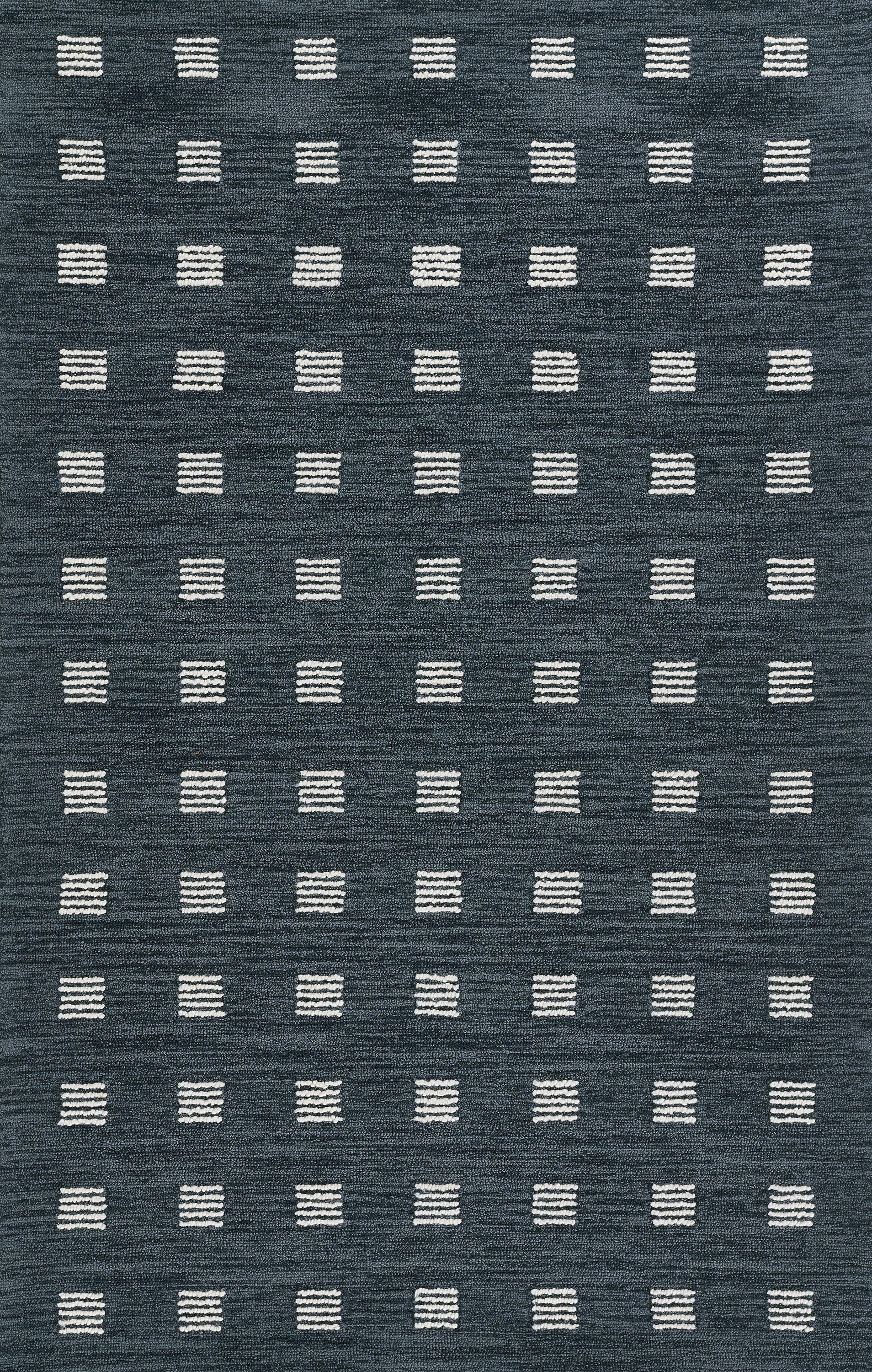 Blue textured rug with repeating white stitched-square blocks forming a geometric grid.