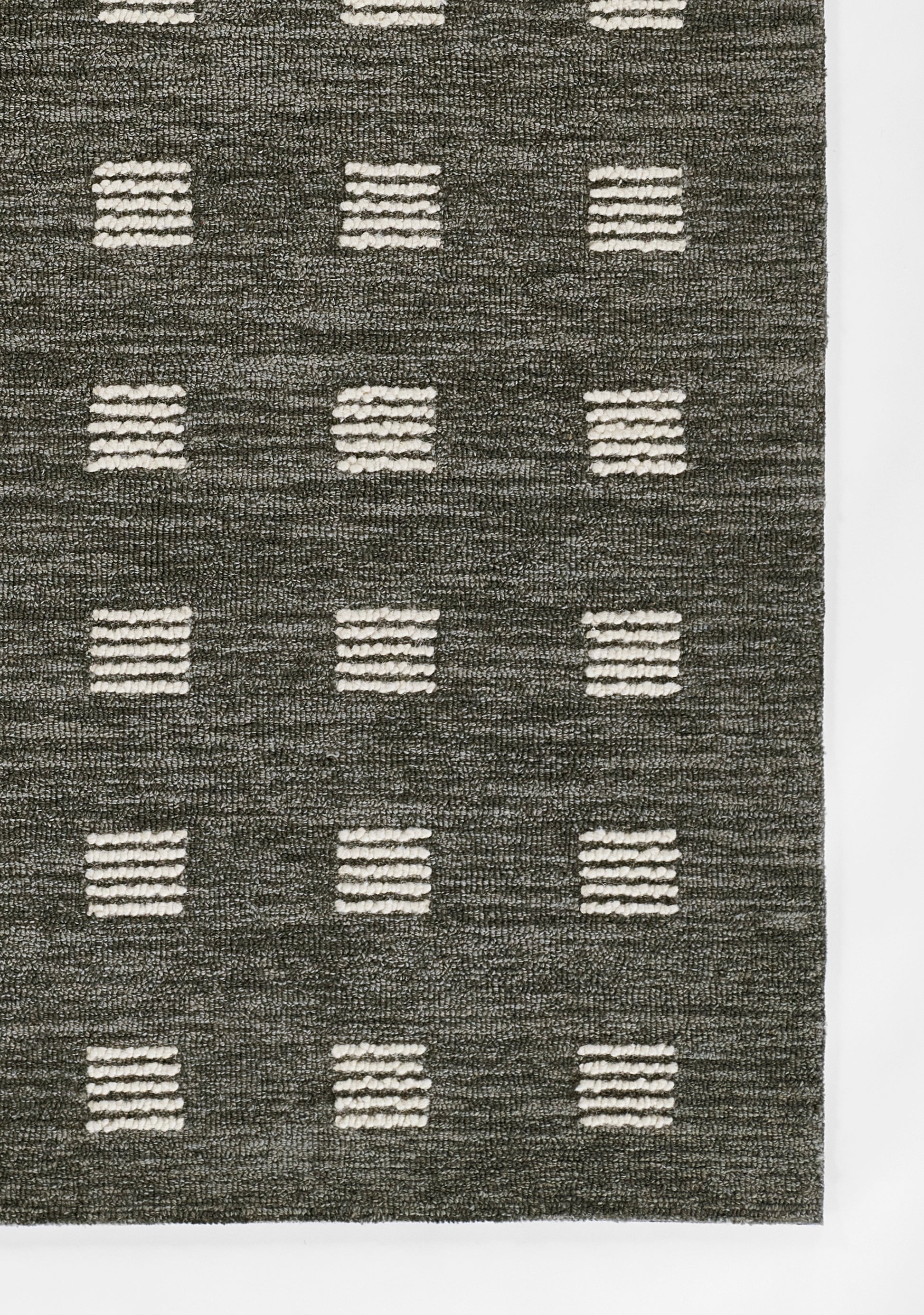Charcoal woven rug with cream square motifs in a grid pattern; rectangular area rug.