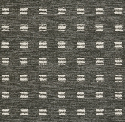 Gray woven rug with white striped square dots in a regular grid; modern geometric pattern.