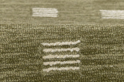 Olive green textured rug with white dash stripe motifs; looped pile, geometric modern pattern.