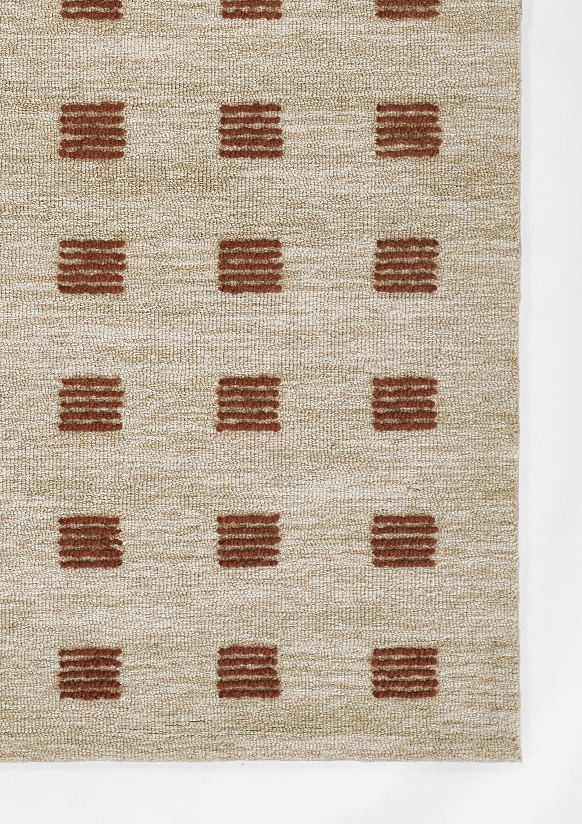 Beige woven runner rug with rust-brown square block motifs in a regular grid; natural fiber texture.