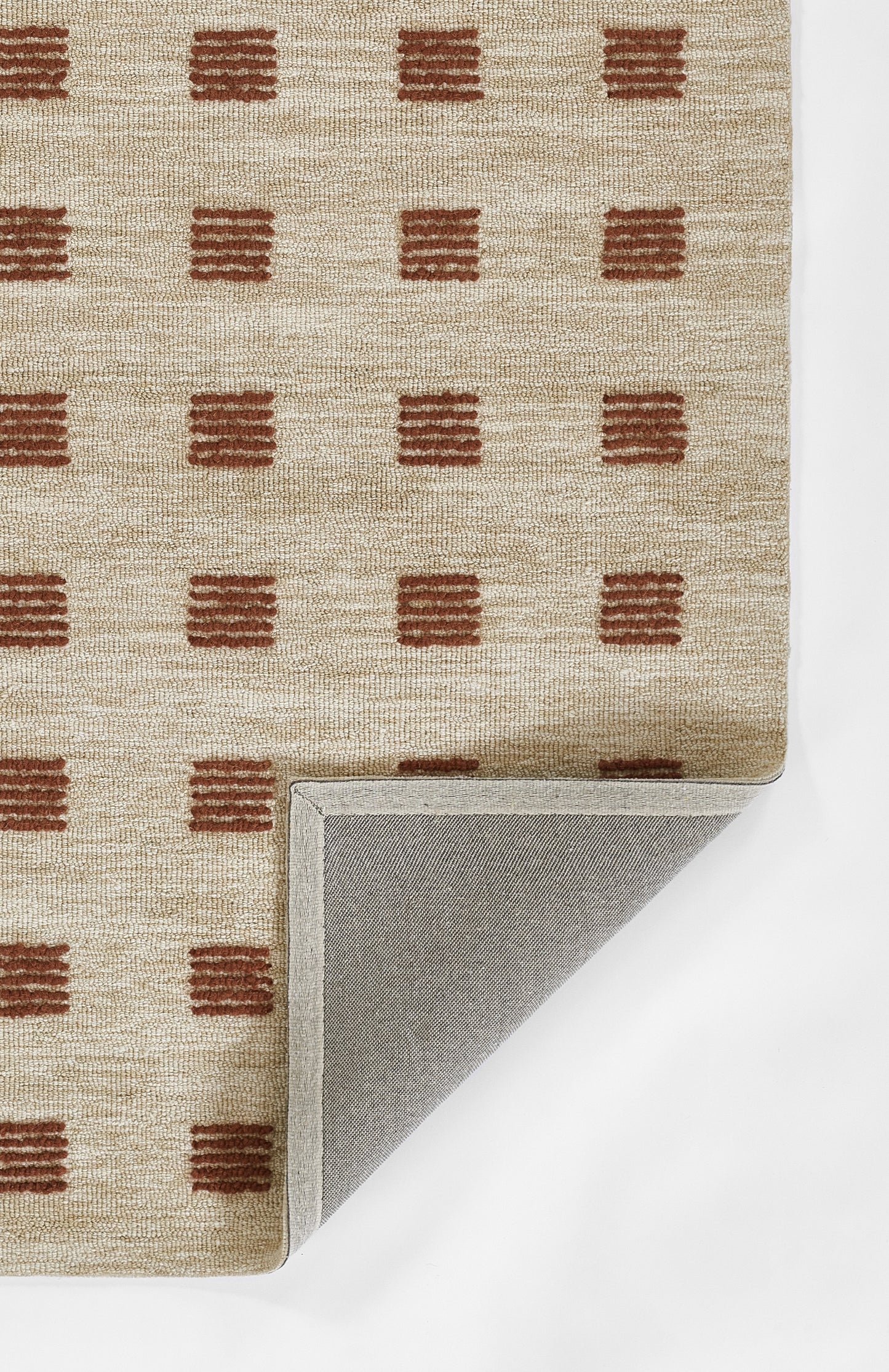 Beige woven area rug with brown square grid pattern; folded corner reveals light gray underside.