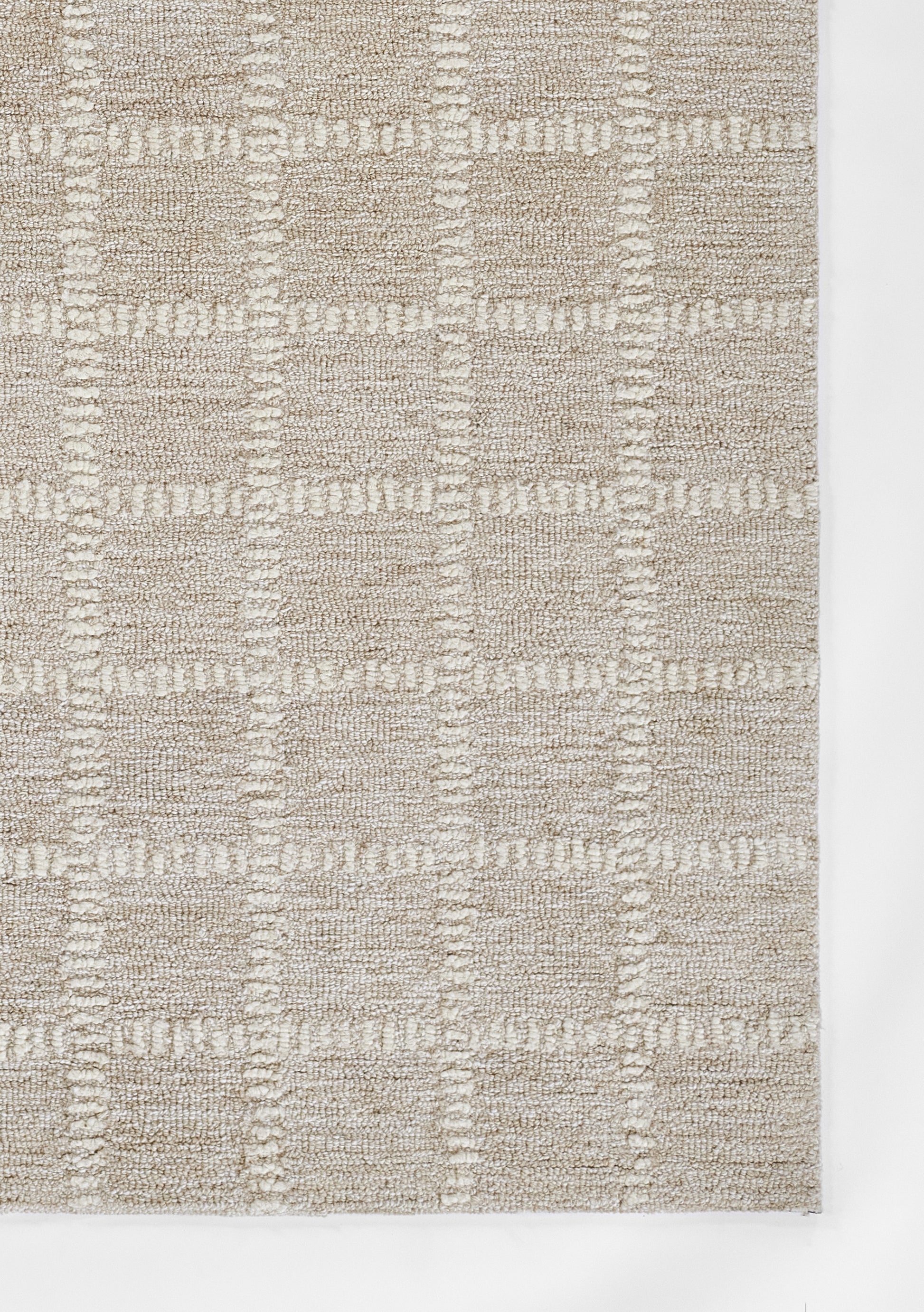 Beige flat-weave area rug with a subtle square grid pattern and textured raised weave for modern neutral decor