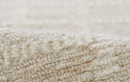 Cream beige plush carpet with dense looped pile; soft, cozy rug.