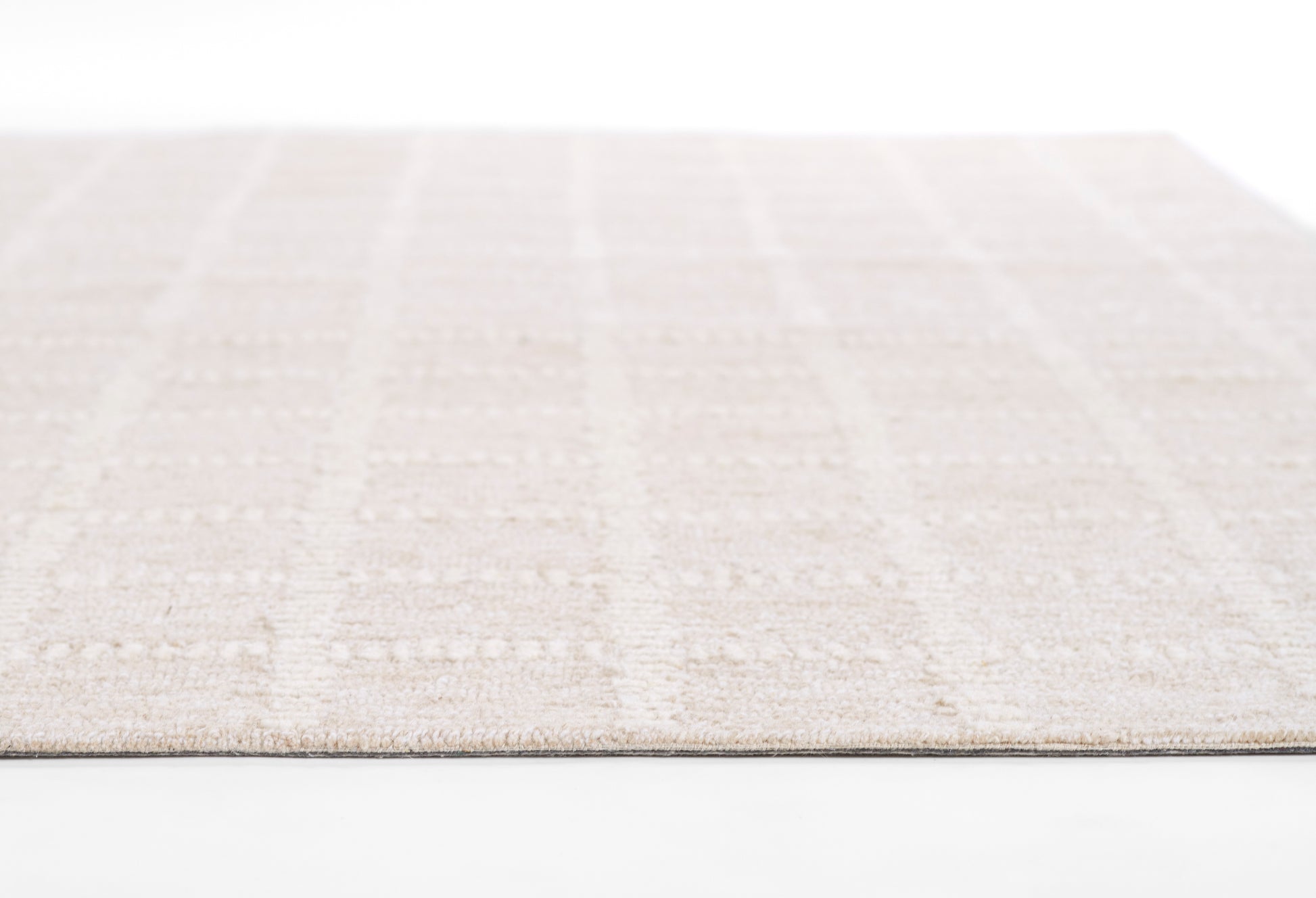 Beige geometric area rug with subtle checker pattern, soft low-pile texture, rectangular for neutral living spaces, 9' x 12'.