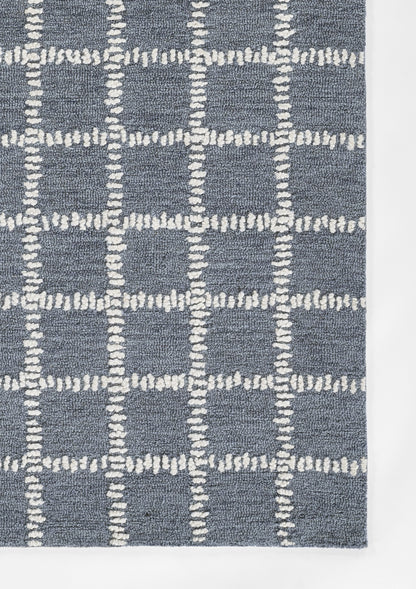 Blue textured area rug with a white dashed grid pattern in plush loop-pile.