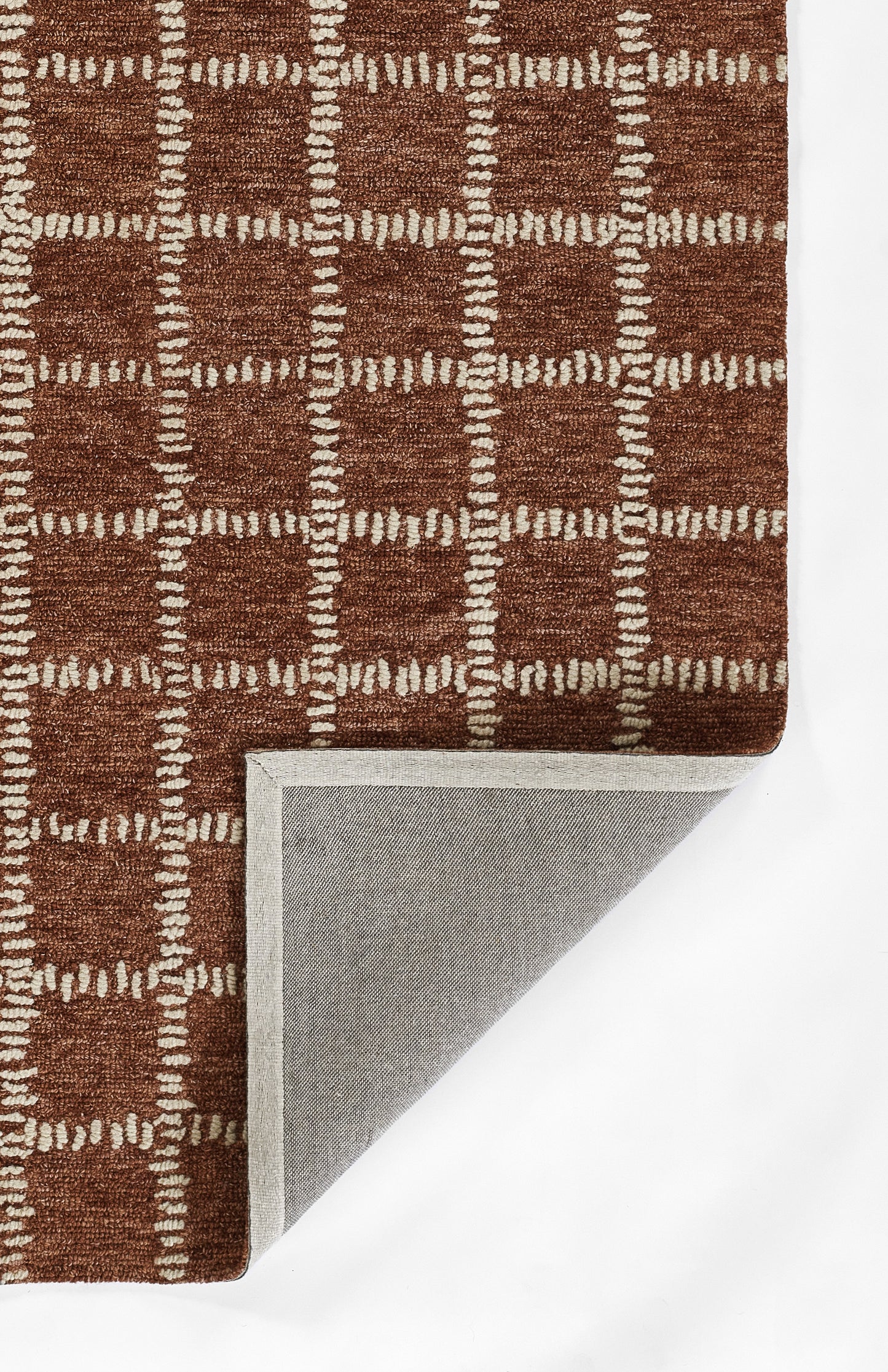 Brown tufted rug with cream square-grid pattern; folded corner reveals gray backing.