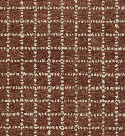 Brown woven rug featuring cream stitched square grid pattern; geometric floor decor.