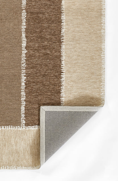 Striped area rug in brown and beige tones with white fringe along edges; corner folded to reveal gray underside.