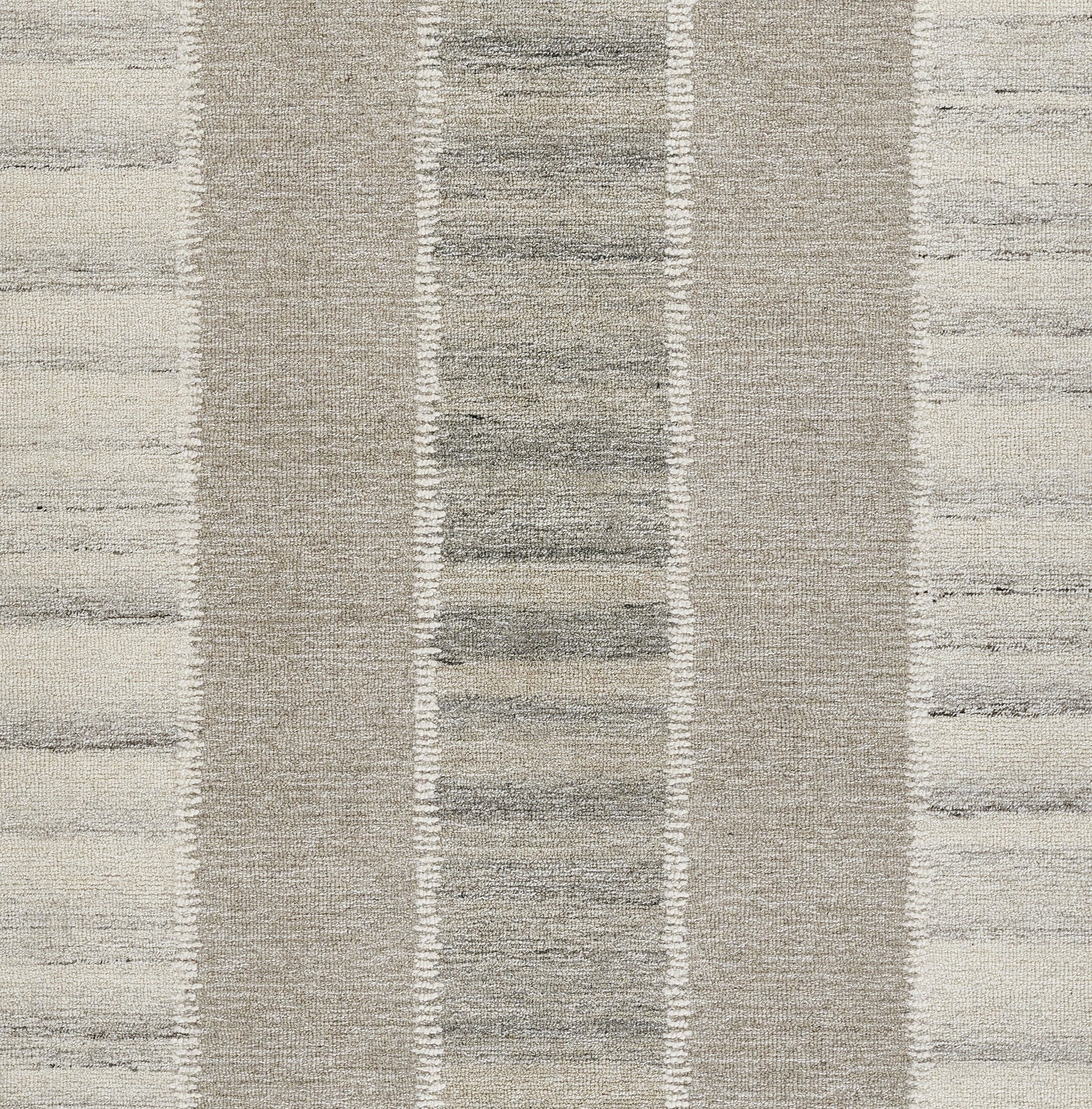 Neutral beige and gray striped area rug with textured woven pile and vertical band pattern.