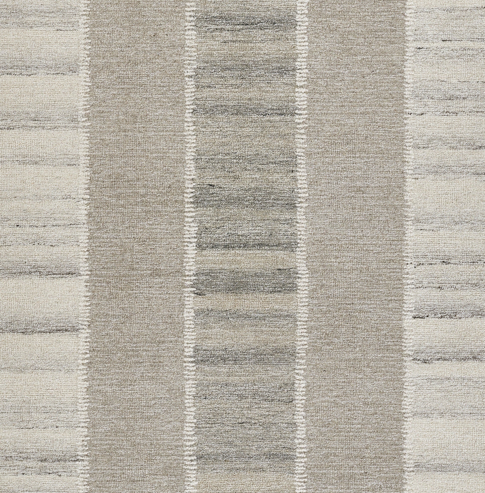 Neutral beige and gray striped area rug with textured woven pile and vertical band pattern.