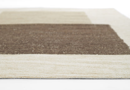 Woven rug with dark brown central band, beige cream borders, and a textured natural-fiber surface.
