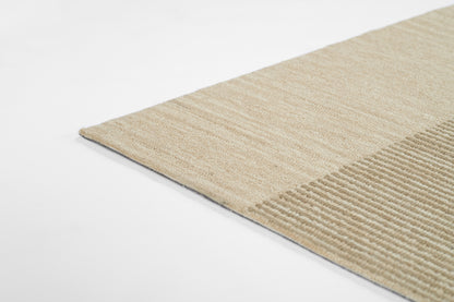 Beige rectangular rug 2' x 3' with two-tone stripes; flat-weave section beside ribbed textured section, cozy neutral decor.